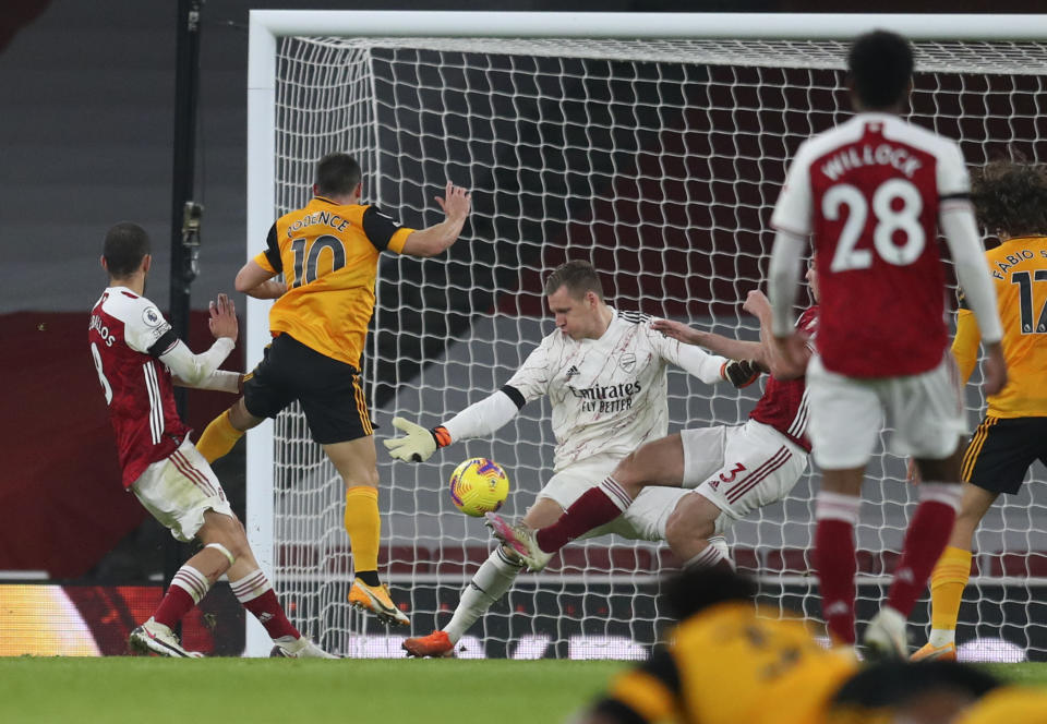 Wolverhampton Wanderers' Daniel Podence, second left, scores his team's second goal during the English Premier League soccer match between Arsenal and Wolverhampton Wanderers at Emirates Stadium, London, Sunday, Nov. 29, 2020. (Catherine Ivill/Pool via AP)