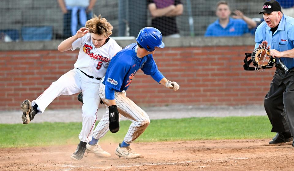 Bourne reliever Tyler Vogel is knocked down as Mitch Jeff of Hyannis arrives safely at home on a wild pitch Tuesday in Bourne. Hyannis went on to win 5-1 for a gallery: https://www.capecodtimes.com/news/photo-galleries/