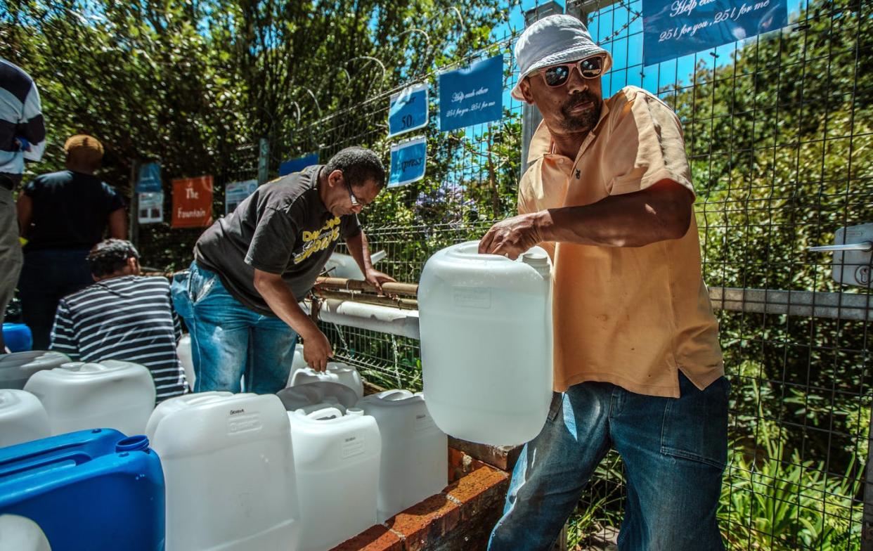 <span class="caption">Cape Town residents queued up for water as the taps nearly ran dry in 2018.</span> <span class="attribution"><a class="link " href="https://www.gettyimages.com/detail/news-photo/cape-town-residents-queue-to-refill-water-bottles-at-news-photo/913638526" rel="nofollow noopener" target="_blank" data-ylk="slk:Morgana Wingard/Getty Images;elm:context_link;itc:0;sec:content-canvas">Morgana Wingard/Getty Images</a></span>