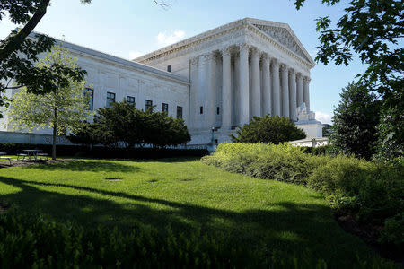 FILE PHOTO: Trees cast shadows outside the U.S. Supreme Court in Washington, U.S., June 25, 2018. REUTERS/Toya Sarno Jordan/File Photo