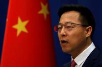 FILE PHOTO: Chinese Foreign Ministry spokesman Zhao Lijian attends a news conference in Beijing