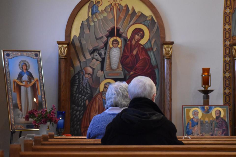 Parishioners of SS. Peter and Paul Ukrainian Catholic Church in Ambridge attend a Sunday morning service on Feb. 27, 2022.