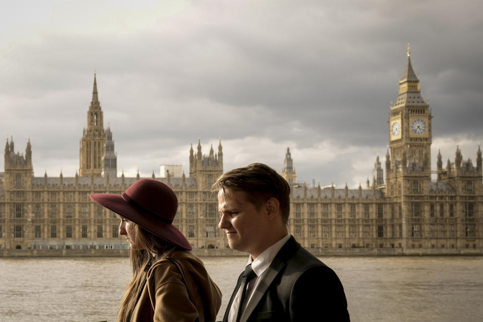 A couple waits in line to pay tribute to Queen Elizabeth II in central London, Thursday, Sept. 15, 2022. The Queen will lie in state in Westminster Hall for four full days before her funeral on Monday, Sept. 19. (AP Photo/Vadim Ghirda)