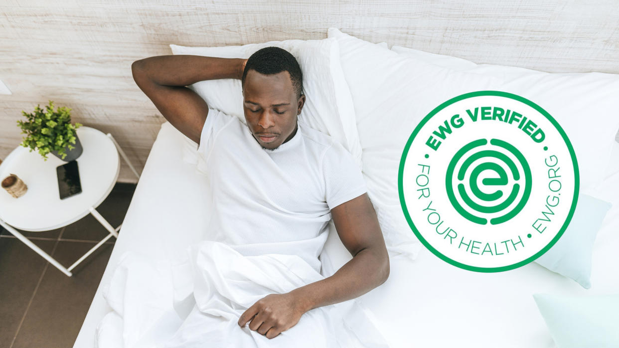  Person sleeping with the EWG verification logo overlaid. 
