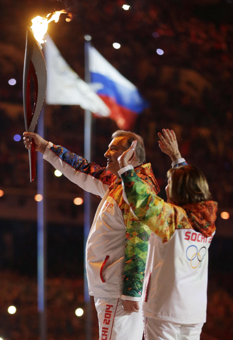 Vladsilav Tretyak holds the torch during the opening ceremony of the 2014 Winter Olympics in Sochi, Russia, Friday, Feb. 7, 2014. (AP Photo/Patrick Semansky)