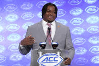 FILE - In this July 17, 2019, file photo, Clemson's John Simpson speaks during the Atlantic Coast Conference NCAA college football media day, in Charlotte, N.C. Simpson was selected to The Associated Press All-Atlantic Coast Conference football team, Tuesday, Dec. 10, 2019. (AP Photo/Chuck Burton, File)