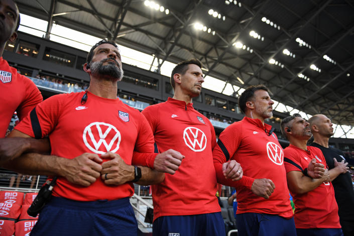 CINCINNATI, OH - JUNE 1: United States coaches link arms during the National Anthem before a game between Morocco and USMNT at TQL Stadium on June 1, 2022 in Cincinnati, Ohio. (Photo by Lee Klafczynski/ISI Photos/Getty Images)