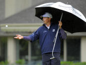 Matt Kuchar flips his ball to his caddy on the fifth green during the second round of the RBC Heritage golf tournament in Hilton Head Island, S.C., Friday, April 18, 2014. (AP Photo/Stephen B. Morton)