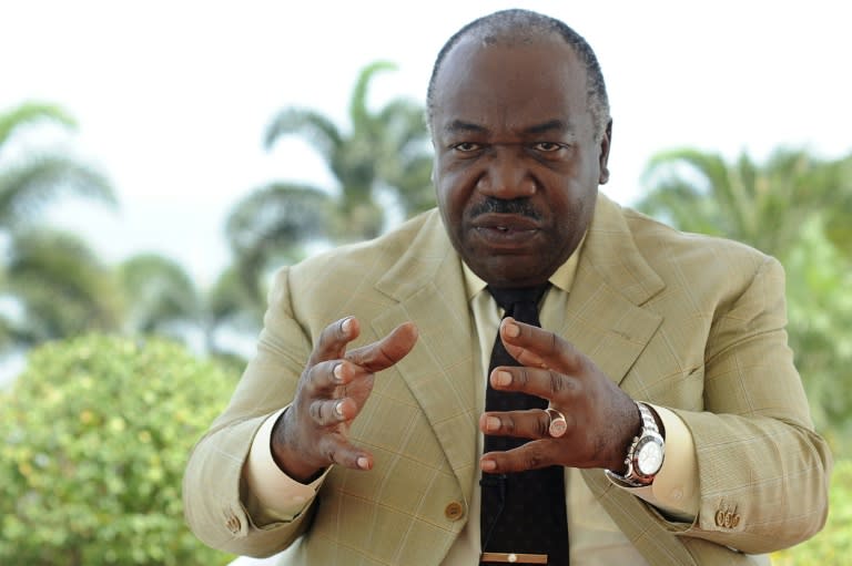 Gabonese President Ali Bongo Ondimba gestures as he speaks to journalists during an interview in Libreville, on August 12, 2016