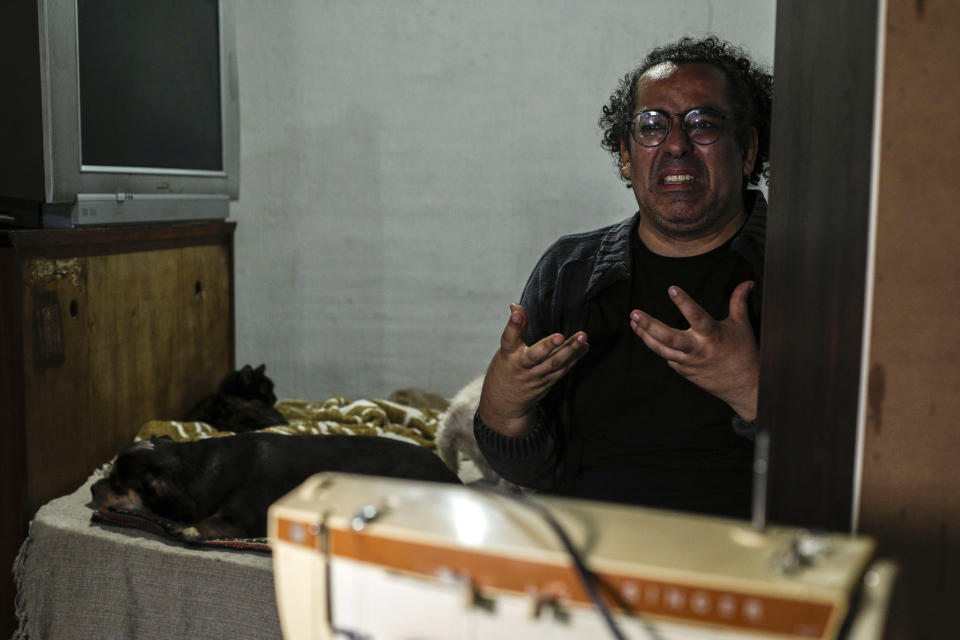 Luiz Cezar Pereira gets emotional when talking about his late mother during an interview at his family's home in Guarulhos, Brazil, Friday, Oct. 1, 2021. Pereira's mother died of COVID-19 and was treated by health care company Prevent Senior, which is under investigation for allegedly forcing doctors to test unproven drugs on coronavirus patients. Pereira's mother was treated with flutamide, a drug typically used for prostate cancer, for which he eventually consented after resisting when his online research found it wasn’t scientifically proven. (AP Photo/Marcelo Chello)