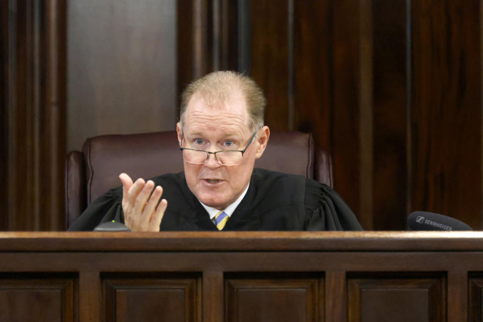 Superior Court Judge Timothy Walmsley speaks during opening statements in the trial of Greg McMichael and his son, Travis McMichael, and a neighbor, William "Roddie" Bryan at the Glynn County Courthouse, Friday, Nov. 5, 2021, in Brunswick, Ga. The three are charged with the February 2020 slaying of 25-year-old Ahmaud Arbery. (Octavio Jones/Pool Photo via AP)