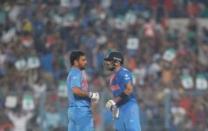 Cricket - India v Pakistan- World Twenty20 cricket tournament - Kolkata, India, 19/03/2016. India's captain Mahendra Singh Dhoni (L) speaks with his teammate Virat Kohli. REUTERS/Rupak De Chowdhuri