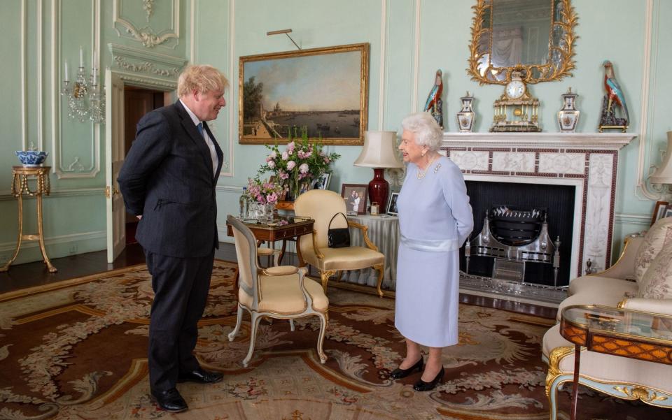The Queen greets Prime Minister Boris Johnson at Buckingham Palace today for their first in-person weekly audience since the pandemic began - Dominic Lipinski/PA
