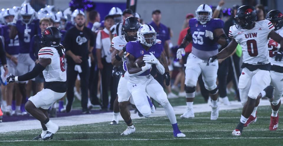 ACU's Jay'Veon Sunday tries to outrun the Incarnate Word defense on a 31-yard gain to the Cardinals' 42. It would lead to Kyle Ramsey's 51-yard field goal 31 seconds before halftime. The Cardinals beat ACU 27-20 in the non-conference game Saturday at Wildcat Stadium in Abilene.