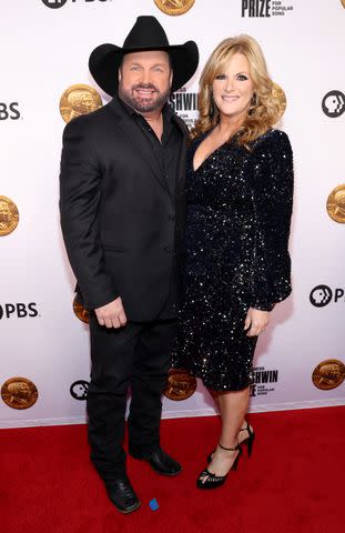 <p>Kevin Mazur/Getty</p> Garth Brooks and Trisha Yearwood in Washington. DC on March 20, 2024