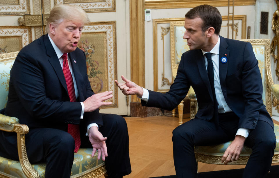 President Trump speaks with French President Emmanuel Macron before their meeting in Paris on Saturday. (Photo: Saul Loeb/AFP/Getty Images)