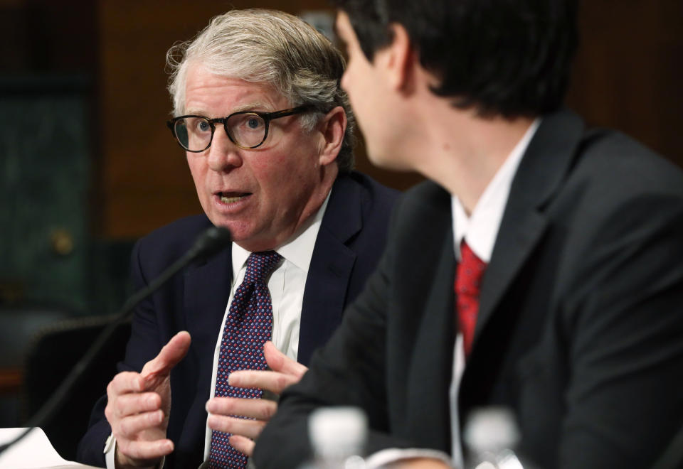 Then-Manhattan District Attorney Cyrus Vance sits at a microphone during a Senate hearing.