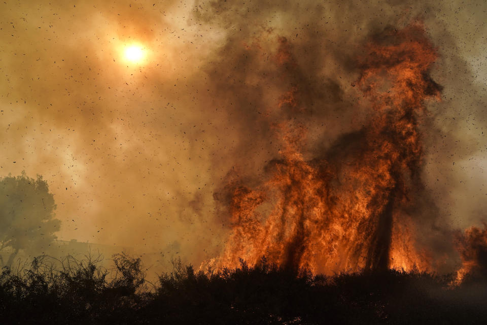 The Silverado Fire burns along the 241 State Highway Monday, Oct. 26, 2020, in Irvine, Calif. (AP Photo/Jae C. Hong)