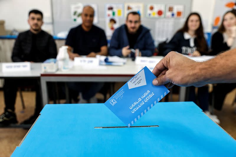 An Israeli man casting his ballot on the day of Israel's general election in a polling station in Rahat, Israel