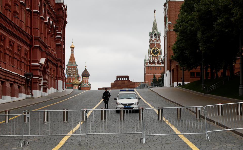 A Russian police officer guards the closed Red Square in Moscow.