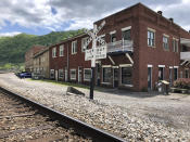 In this Tuesday, May 12, 2020, is a former corner post office in Matewan, W.Va. On May 19, 1920, coal miners, led by a local police chief, and detectives hired by a coal company to evict unionizing miners from their homes were involved in a gun battle on the street. Ten people died in the Matewan Massacre. (AP Photo/John Raby)