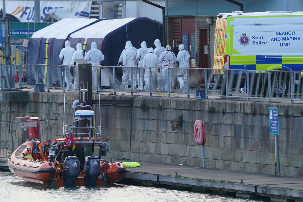 Police forensic officers at the RNLI station at the Port of Dover following the disaster on 14 November last year  (PA Wire)