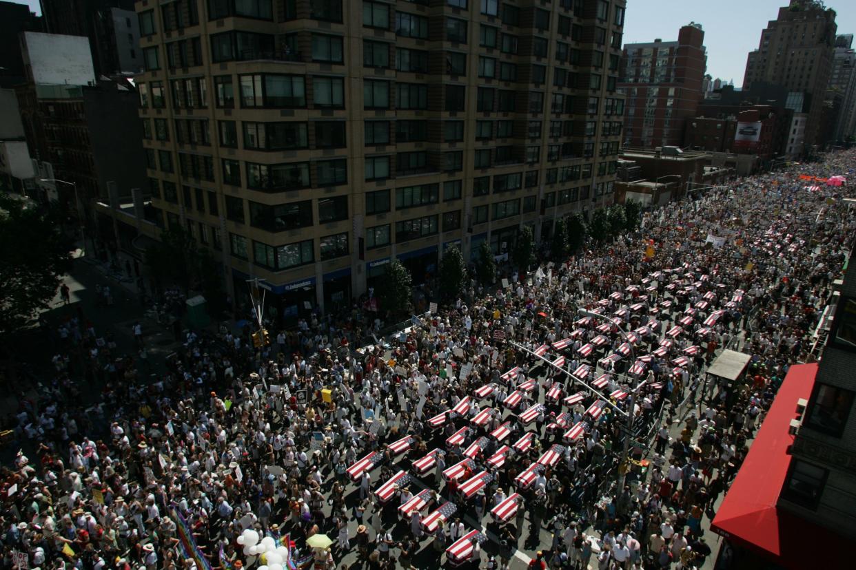 Rows of boxes shaped like coffins, draped with flags representing American soldiers killed in Iraq are carried by demonstrators marching during an anti-Bush protest in New York City on Aug. 29, 2004, the eve of the Republican National Convention.