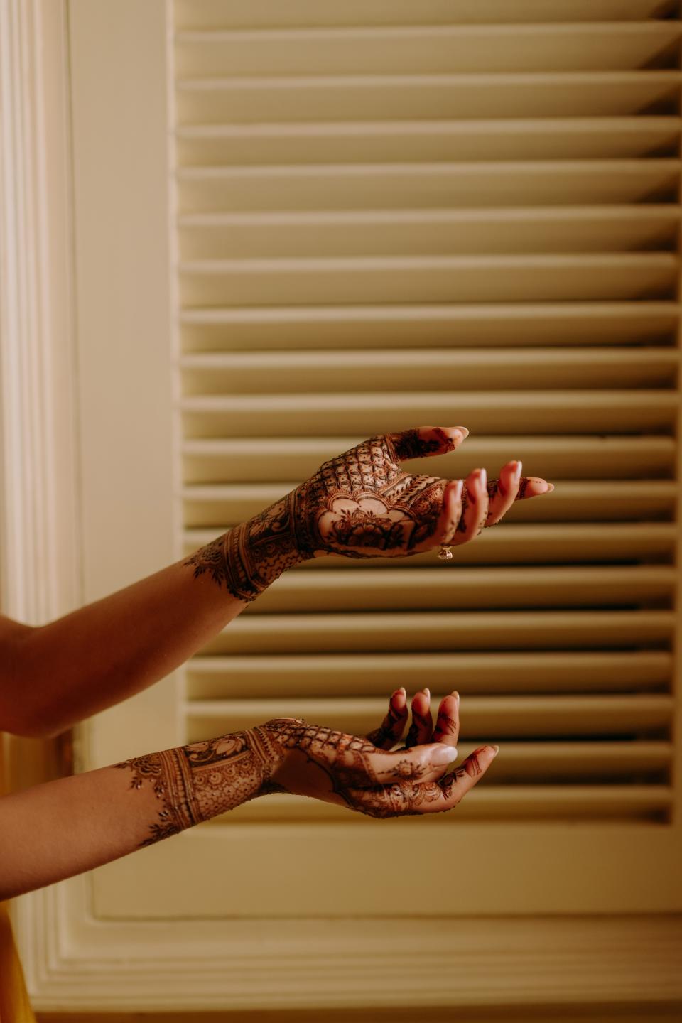 Mitali shows off her henna from the pre-wedding mehendi ceremony.