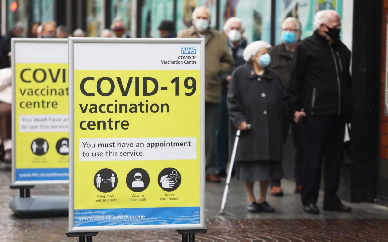 People queue to receive Covid vaccinations in Folkestone, Kent, last month - Chris Ratcliffe/Bloomberg