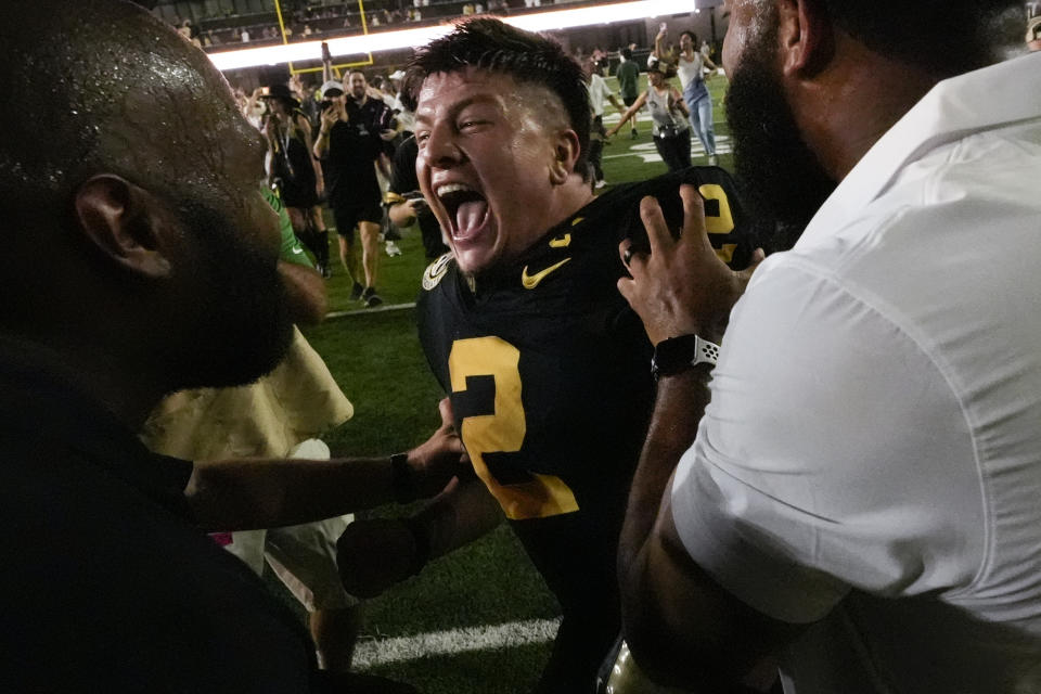 Vanderbilt quarterback Diego Pavia (2) celebrates the team's 40-35 victory over No. 1 Alabama after an NCAA college football game on Saturday, Oct. 5, 2024, in Nashville, Tenn. (AP Photo/George Walker IV )