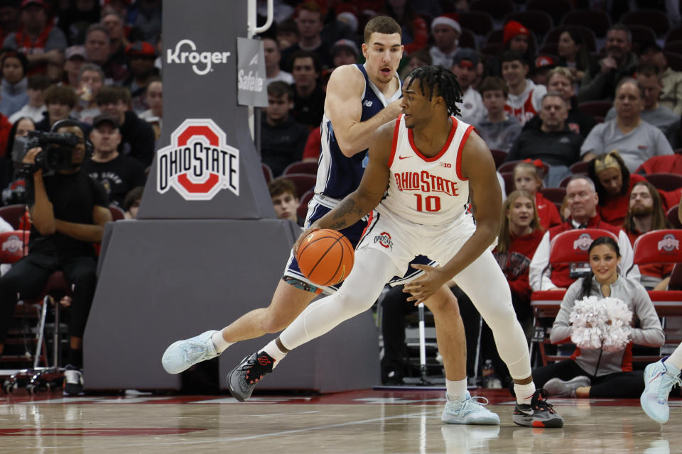 Ohio State's Brice Sensabaugh, right, posts up against Maine's Peter Filipovity during the first half of an NCAA college basketball game on Wednesday, Dec. 21, 2022, in Columbus, Ohio. (AP Photo/Jay LaPrete)