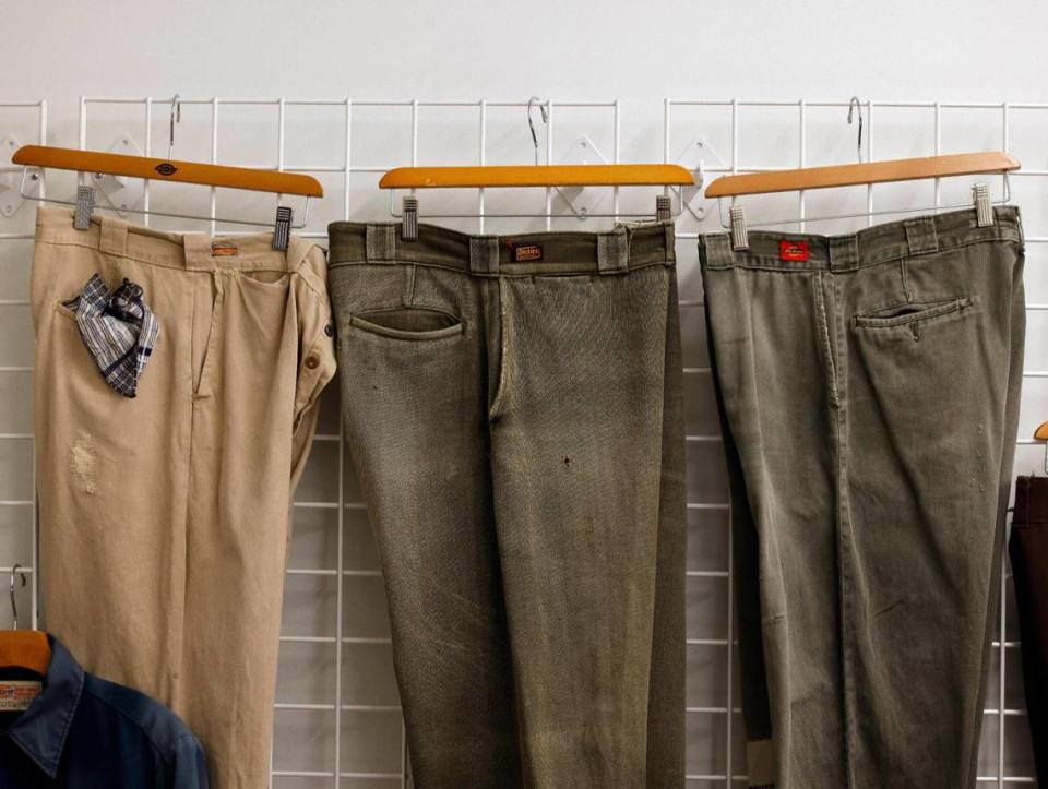 Work pants from the 30’s, 40’s and 50’s hang on a wall in the archive room at Dickies Quality Workwear and Apparel offices in downtown Fort Worth Texas, Thursday Mar. 28, 2024.