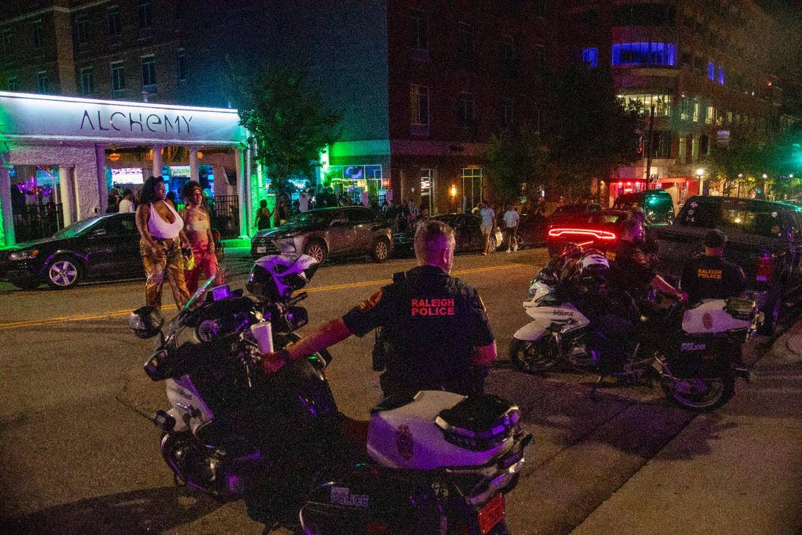 Raleigh Police officers maintain a presence at around 1:30 a.m. in the Glenwood South district on Friday, July 21, 2023.