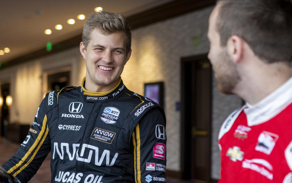 IndyCar driver Marcus Ericsson, of Sweden, speaks with fellow driver Ed Jones during IndyCar auto racing media day, Monday, Feb. 11, 2019, in Austin, Texas. (AP Photo/Stephen Spillman)