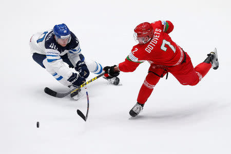 2016 IIHF World Championship - Group B - Finland v Belarus - St. Petersburg, Russia - 6/5/16 - Jarno Koskiranta of Finland in action with Kiril Gotovets of Belarus. REUTERS/Maxim Zmeyev