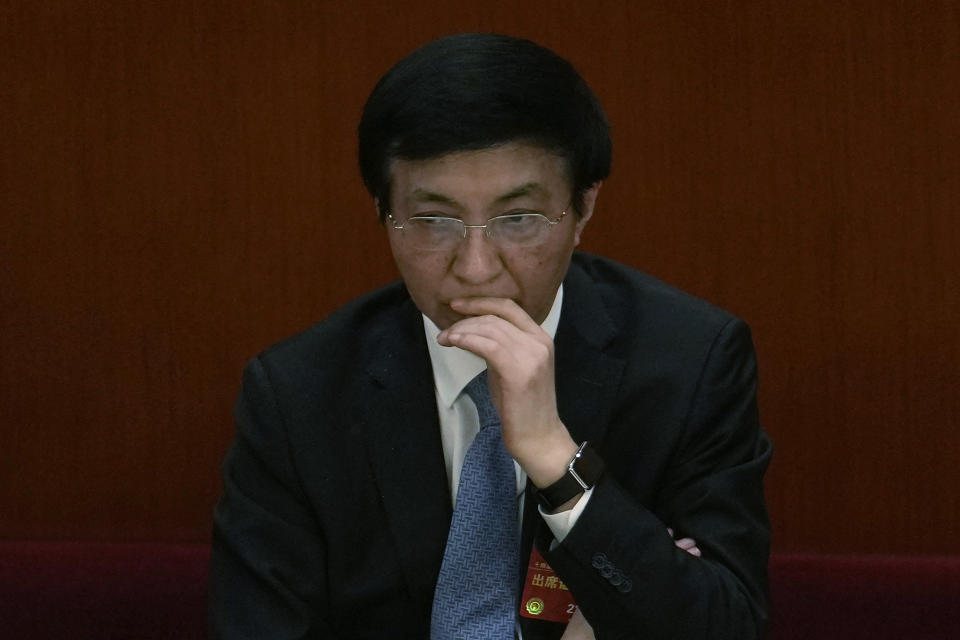 Politburo Standing Committee member Wang Huning attends a session of China's National People's Congress (NPC) at the Great Hall of the People in Beijing, Tuesday, March 7, 2023. Another returnee from the previous standing committee, Wang Huning is from an academic background, having been a professor of international politics at Shanghai's Fudan University and a senior adviser to two of Xi's predecessors. Unusual for a top official, Wang, 67, has never held office at either the local or central government level. (AP Photo/Ng Han Guan)