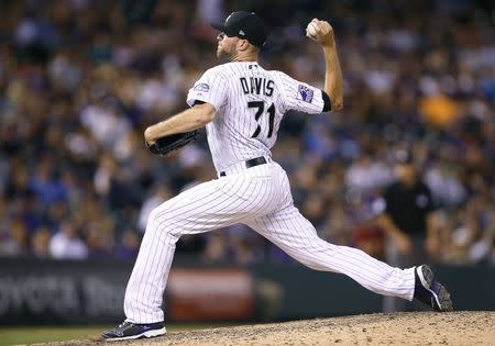 Jul 14, 2018; Denver, CO, USA; Colorado Rockies relief pitcher Wade Davis (71) pitches in the ninth inning against the Seattle Mariners at Coors Field. Mandatory Credit: Russell Lansford-USA TODAY Sports