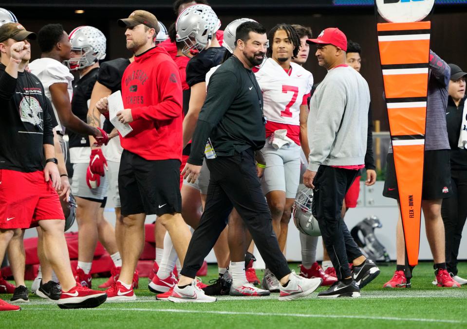 Dec 29, 2022; Atlanta, GA, USA; Ohio State Buckeyes head coach Ryan Day walks the sidelines during team practice for the Peach Bowl at the Mercedes-Benz Stadium.