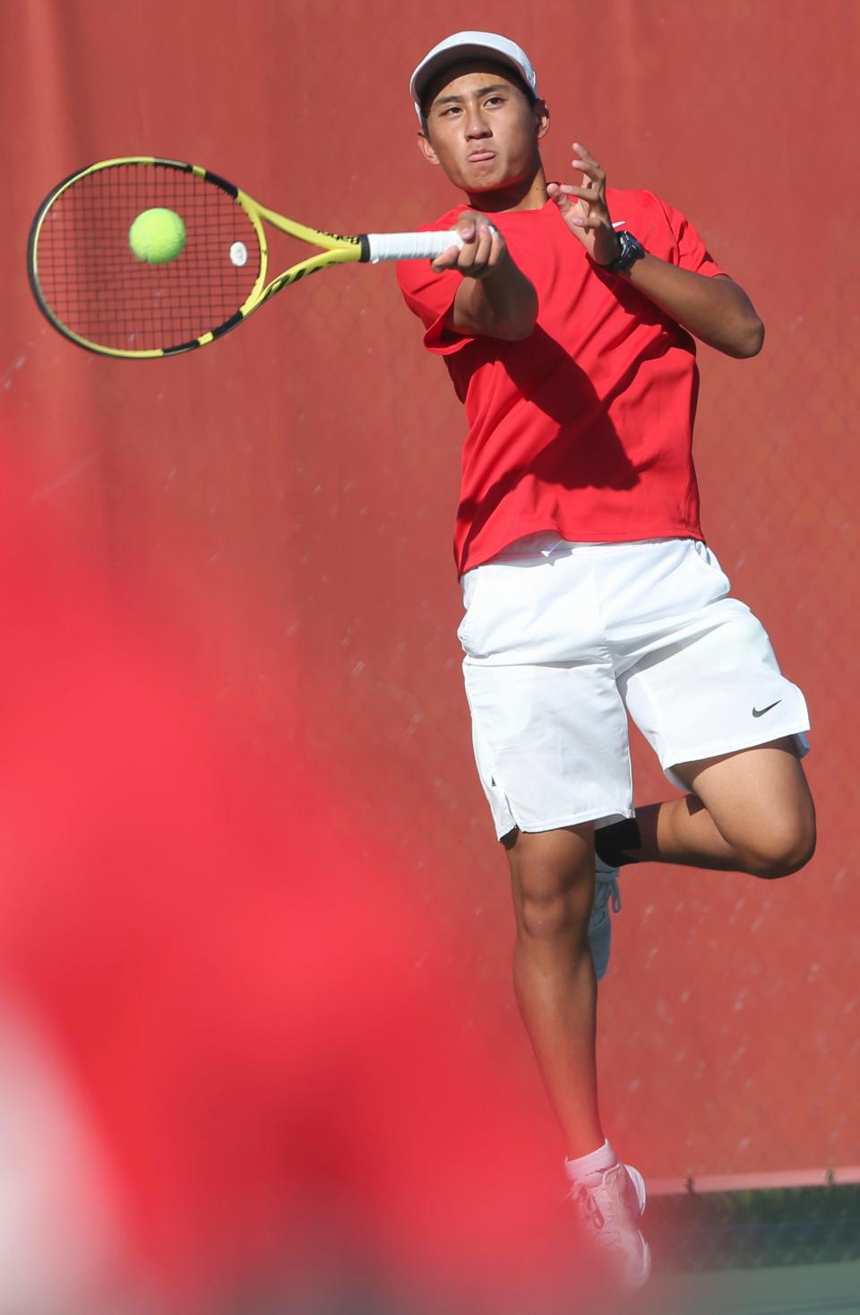 West Lafayette tennis player Jasper Xiang hits the ball Thursday, Oct. 3, 2024, during the IHSAA boys tennis sectionals championship at Harrison High School in West Lafayette, Ind. West Lafayette won 3-2.