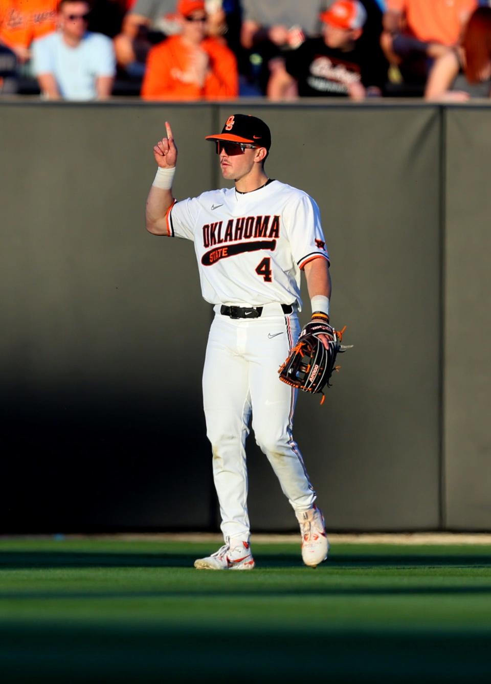 Oklahoma State's Zach Ehrhard (4) signals an out during the college Bedlam baseball game between Oklahoma State University Cowboys and the University of Oklahoma Sooners at O'Brate Stadium in Stillwater, Okla., Friday, April 5, 2024.