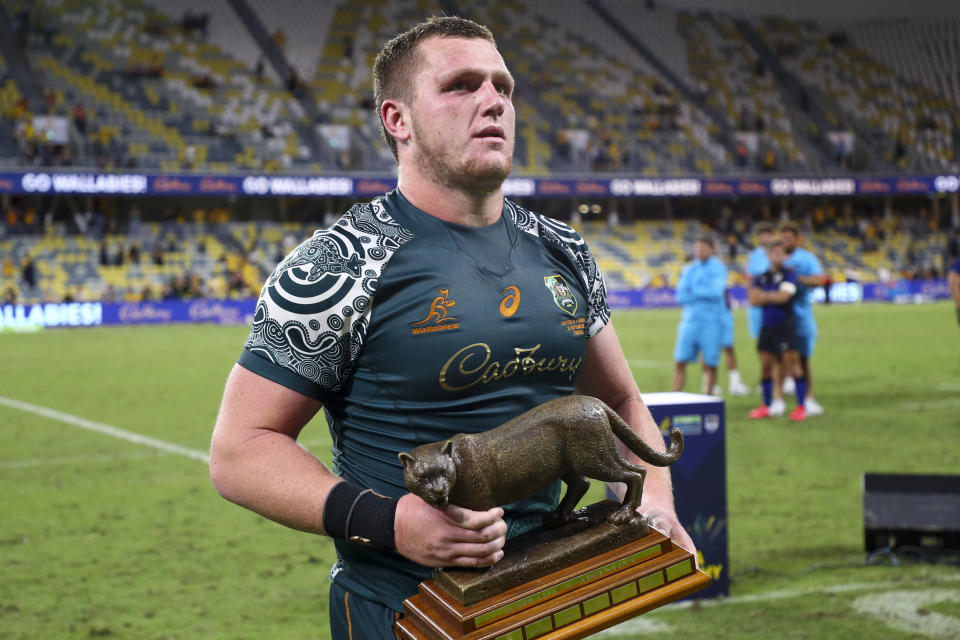 Australia's Angus Bell carries the trophy following the Rugby Championship test match between the Pumas and the Wallabies in Townsville, Australia, Saturday, Sept. 25, 2021. (AP Photo/Tertius Pickard)