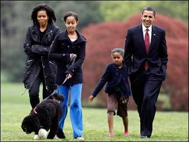 Malia Obama walks with new dog Bo, followed by President Barack Obama, Sasha Obama and first lady Michelle Obama on the South Lawn at the White House in Washington, Tuesday, April 14, 2009. (AP Photo./Charles Dharapak / Credit: AP Photo/Charles Dharapak