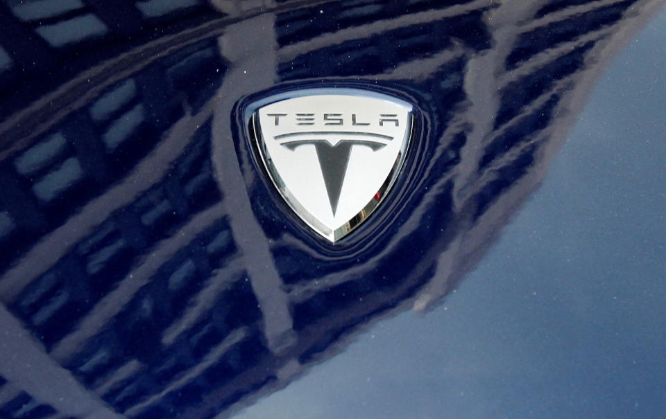 A logo of Tesla Motors on an electric car model is seen outside a showroom in New York June 28, 2010.   REUTERS/Shannon Stapleton