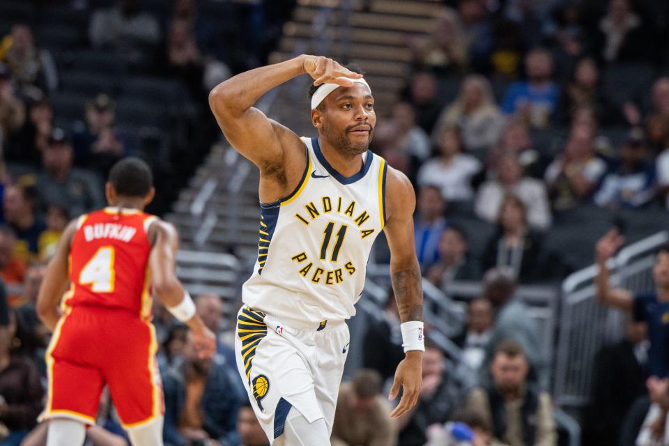 Oct 16, 2023; Indianapolis, Indiana, USA; Indiana Pacers forward Bruce Brown (11) celebrates a made three point basket in the first quarter against the Atlanta Hawks at Gainbridge Fieldhouse. Mandatory Credit: Trevor Ruszkowski-USA TODAY Sports