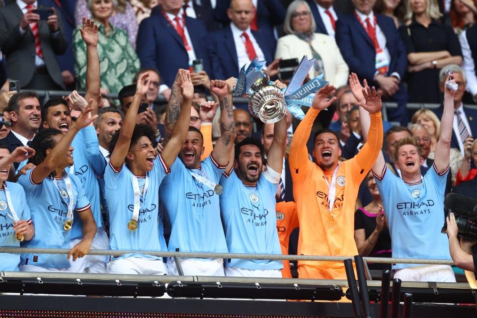 Captain Fantastic: Ilkay Gundogan lifts the cup  (REUTERS)