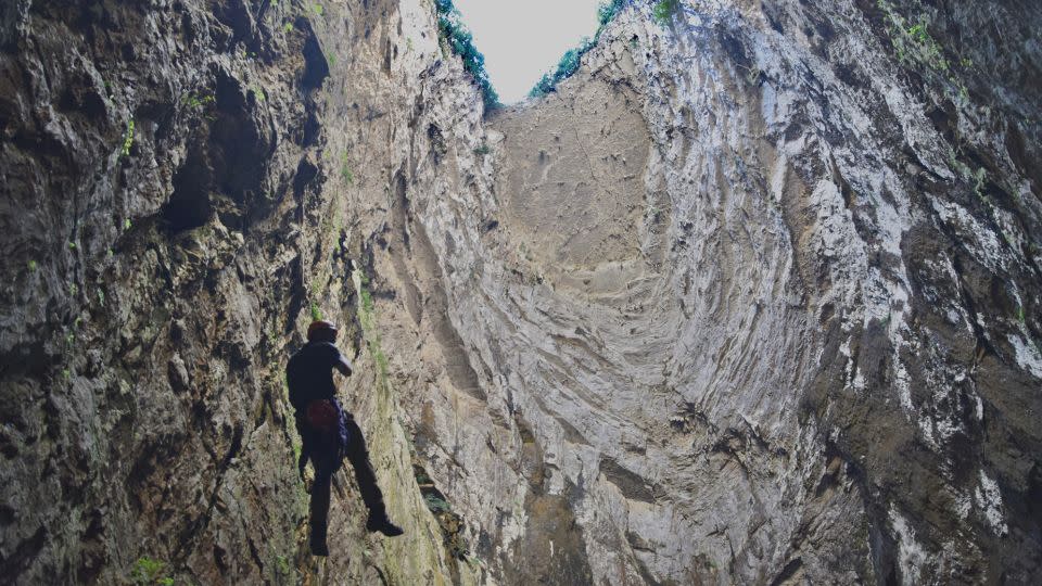 Miguel Galarraga of Corazon de Xoconostle Tours descends into a sinkhole known as Sotano de las Huahuas. - Mark Johanson/Chicago Tribune/Newscom