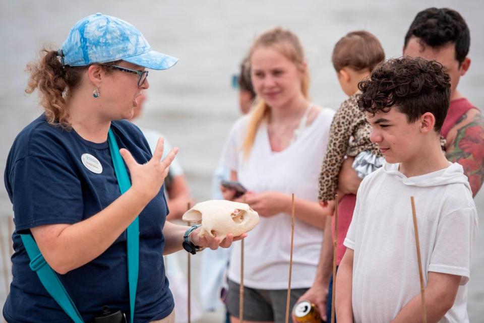 A Mississippi Aquarium worker teaches onlookers about Kemp’s Ridley sea turtles before 16 of them are released into the Mississippi Sound in Biloxi on Thursday, April 18, 2024.