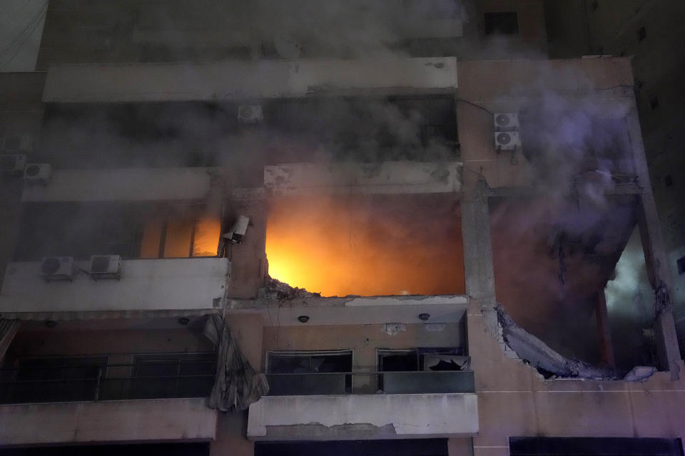 Smoke and flame rise from a destroyed apartment as following a massive explosion in the southern suburb of Beirut, Lebanon, Tuesday, Jan. 2, 2024. The TV station of Lebanon's Hezbollah group says top Hamas official Saleh Arouri was killed Tuesday in an explosion in a southern Beirut suburb.(AP Photo/Hussein Malla)