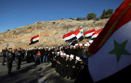 Druze Arabs on the Israeli-occupied Golan Heights hold an anti-election protest outside a municipal polling station in Majdal Shams, October 30, 2018 REUTERS/Ammar Awad