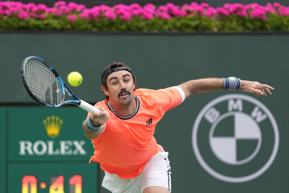 Jordan Thompson, of Australia, returns a shot to Stefanos Tsitsipas, of Greece, at the BNP Paribas Open tennis tournament Friday, March 10, 2023, in Indian Wells, Calif. (AP Photo/Mark J. Terrill)